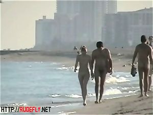 voyeurism at a molten nudist duo on the beach