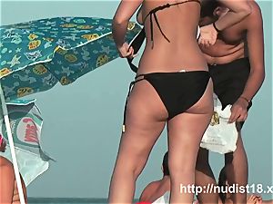 bare beach hidden cam video of steamy playful nudists in water